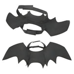 Black bat wings with straps on a white background