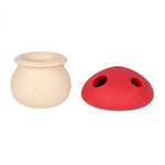 Beige and red ceramic items on a white background