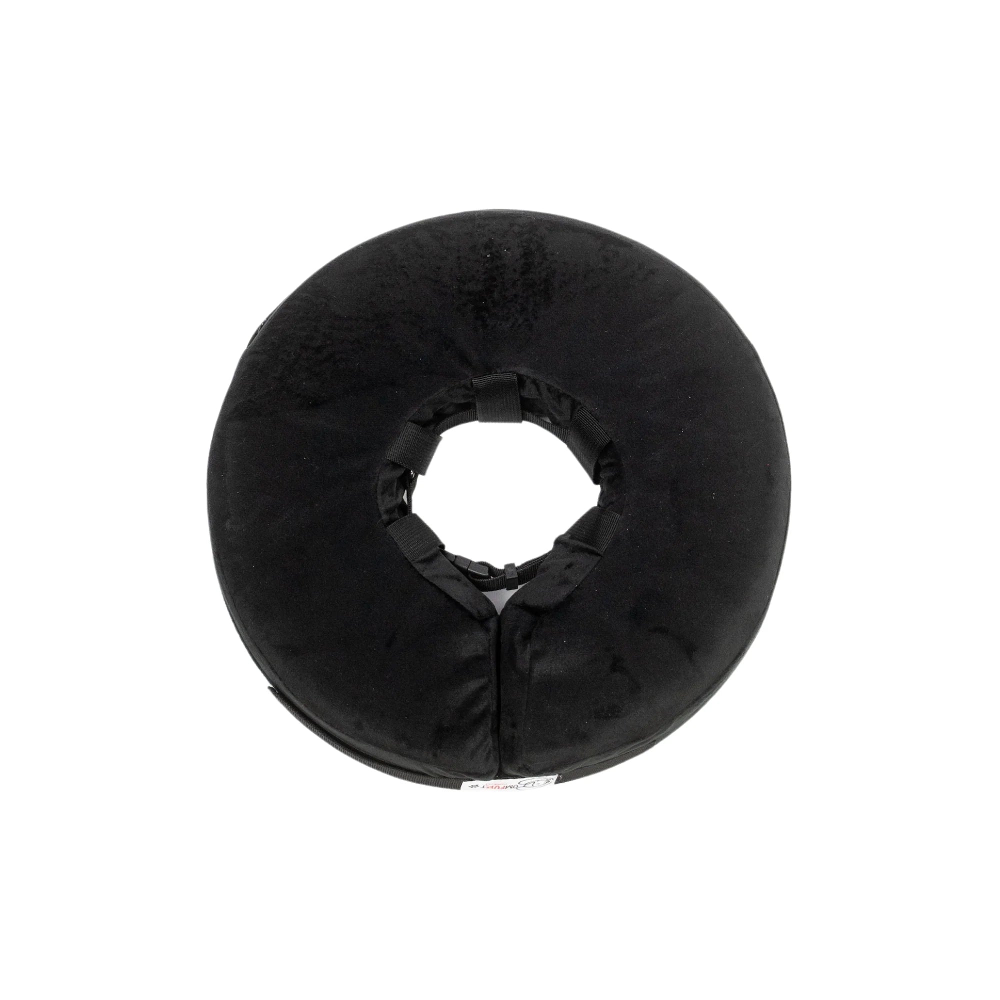 Black donut-shaped pillow on a white background