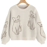 Beige sweater with cat illustrations on a white background