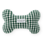 A bone-shaped dog toy made of green and white gingham fabric, featuring a white label in the center that reads 'THE FOGGY DOG 