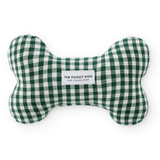 A bone-shaped dog toy made of green and white gingham fabric, featuring a white label in the center that reads 'THE FOGGY DOG 