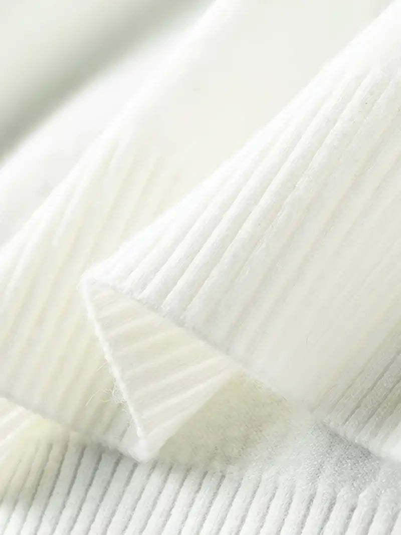 Close-up of a textured white fabric with a subtle pattern