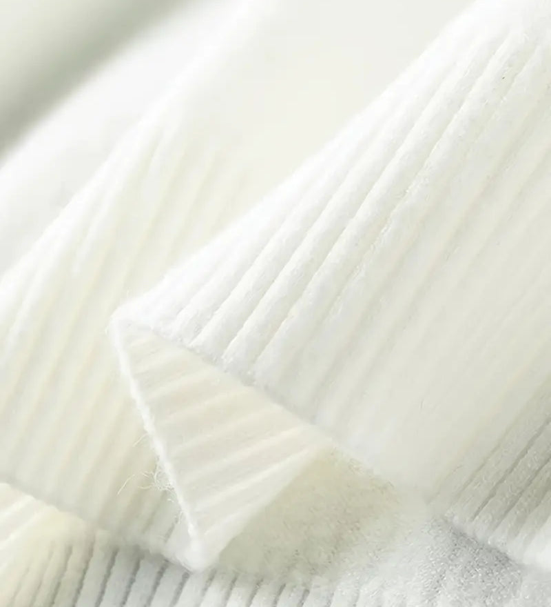 Close-up of a textured white fabric with a subtle pattern