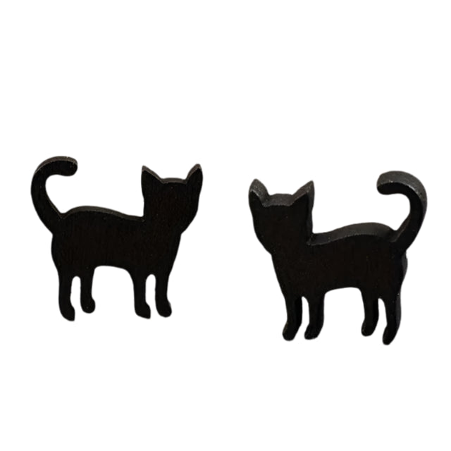 Black cat-shaped earrings on a wooden surface