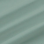 Close-up of teal fabric with visible texture