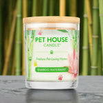 Pet House Candle with bamboo watermint scent on a wooden surface with a bamboo background