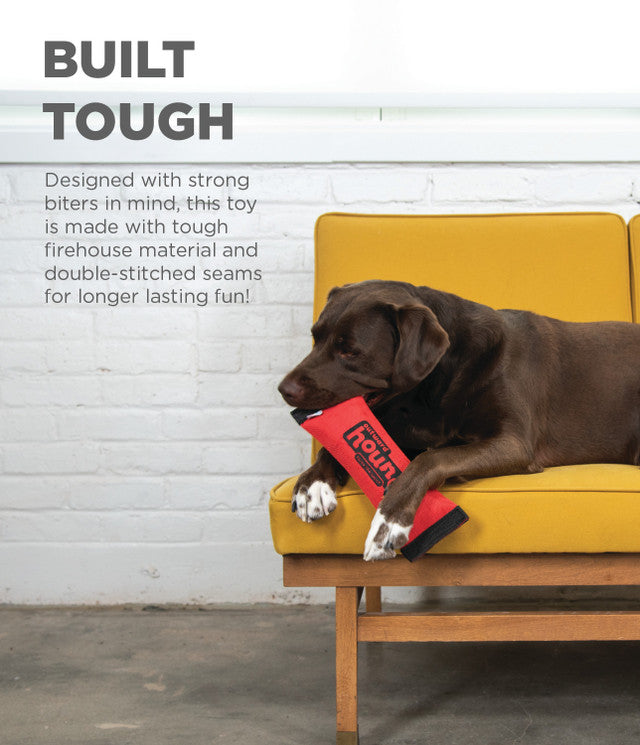 Dog chewing on a red toy with text about durability on a yellow couch.
