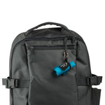 Gray backpack with a blue item attached on a white background