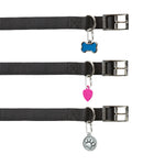 Three black dog collars with different shaped charms on a white background