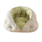 A plush pet bed with a soft, cloud-like shape, featuring a light grey fuzzy exterior and a textured light green ribbed interior, shown against a plain white background.