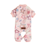 Plush pink pet pajamas with stars and moons against a white background.