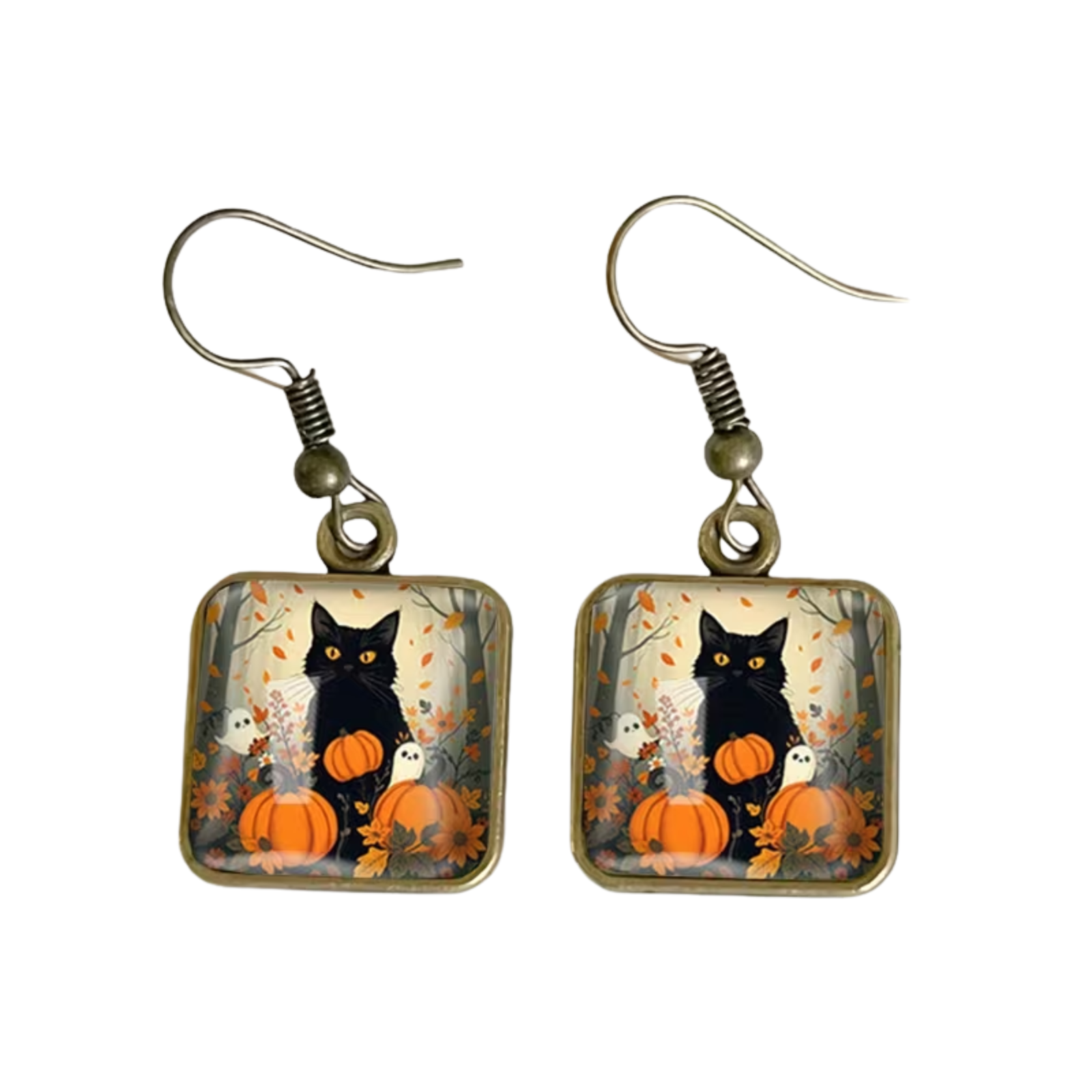 A pair of dangling earrings with square glass charms showing a black cat sitting on a pumpkin in an autumn scene, with bronze-tone fishhook wire.