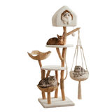 A tall multi-level cat tree with natural wood posts, cream carpeted platforms and house, woven basket perches, and a hanging macrame hammock, shown on a white background with four cats resting on different parts of the tree.