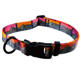 A dog collar with a colorful mountain pattern in shades of orange, pink, purple, and gray, featuring a black plastic buckle and a black metal ring.