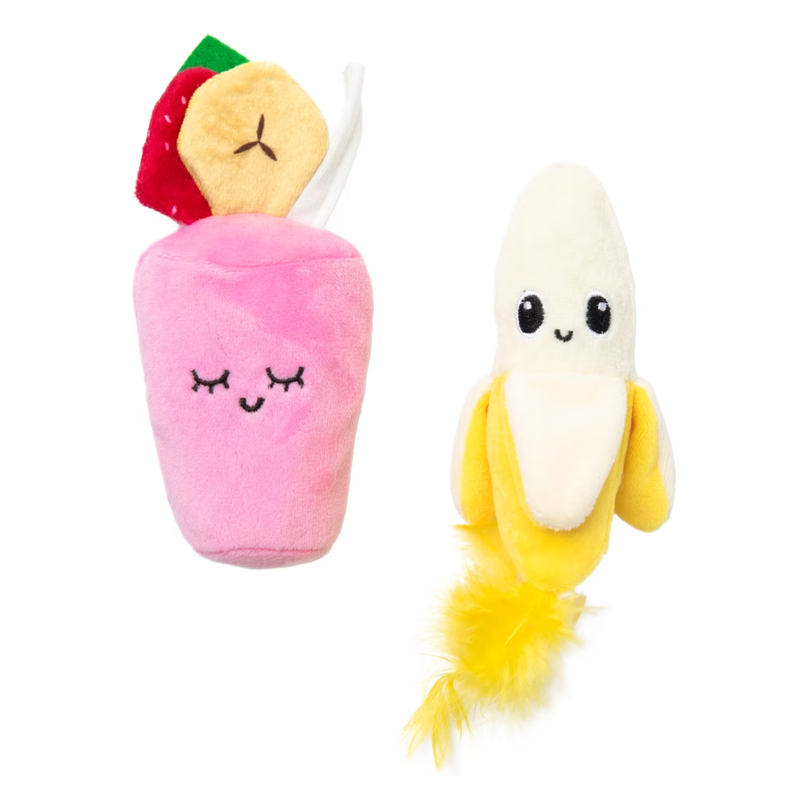 Two plush novelty toys on a plain white background: a pink cup-shaped plush with a strawberry and banana decoration and a banana-shaped plush with yellow feathers at the tail.