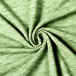 A close-up of light olive green heathered fabric arranged in a spiral drape, showing the texture and color variation.