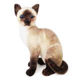 A plush Siamese cat toy with a cream and tan body, dark brown paws, face, and tail, and bright blue eyes, photographed on a plain white background.