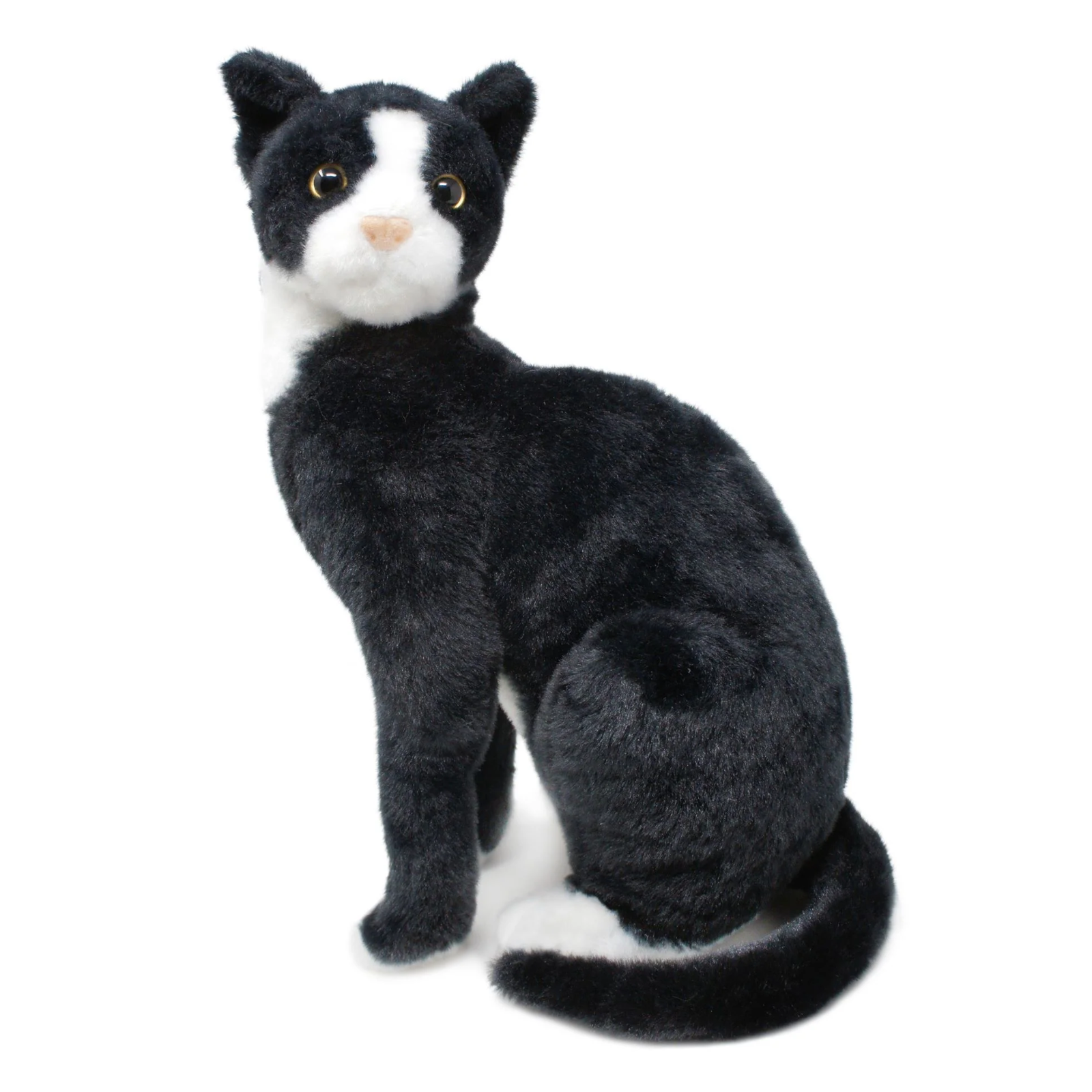 A black and white plush cat toy sitting upright on a plain white background.