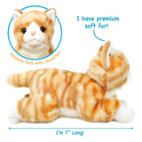An orange and white tabby cat plush toy lying down on a white background with blue direction arrows indicating the toy is 7 inches long and a detail circle highlighting the realistic character face.