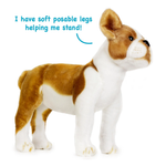 A brown and white plush puppy toy standing on a white background, with blue text reading 'I have soft posable legs helping me stand!' above it.