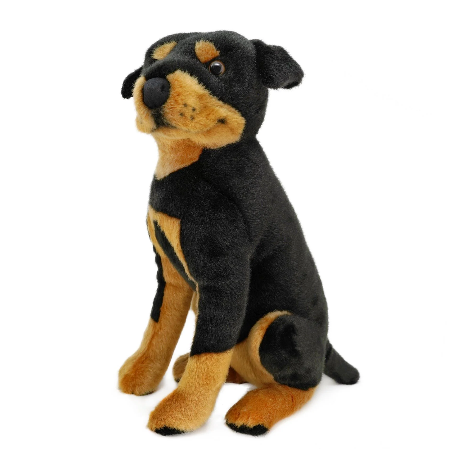 A plush Rottweiler dog toy sitting upright against a plain white background.