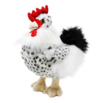 A plush toy rooster with a white body, black speckled feathers, a bright red comb and wattle, and beige legs, photographed on a plain white background.
