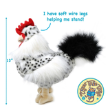 A plush rooster toy with white and black speckled feathers, a red comb, beige feet, and soft black wire legs, shown on a white background with a height measurement marker showing 13 inches tall and blue text reading 'I have soft wire legs helping me stand!' A circular Tiger Tale Toys logo appears in the lower right corner