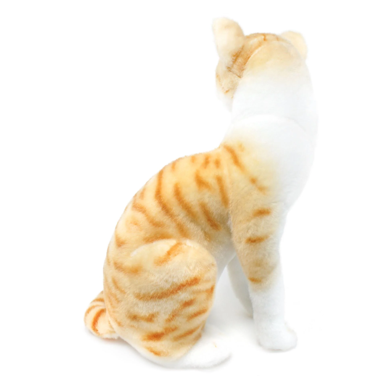 A plush toy cat in a sitting position, viewed from the back, featuring orange and white tabby fur details on a solid white background.