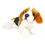 A plush white, brown, and black dog positioned lying down.