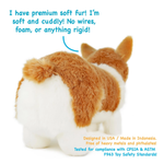 A plush tan and white Corgi shown from behind with popup text highlighting the premium soft fur and lack of rigid parts.