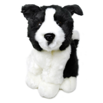 A black and white plush puppy toy with floppy ears, a white muzzle and chest, and a black back, photographed on a plain white background.