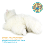 A fluffy white stuffed animal toy shaped like a cat lying down, shown on a plain white background with a circular Tiger Tales logo in the top right and product safety text at the bottom.