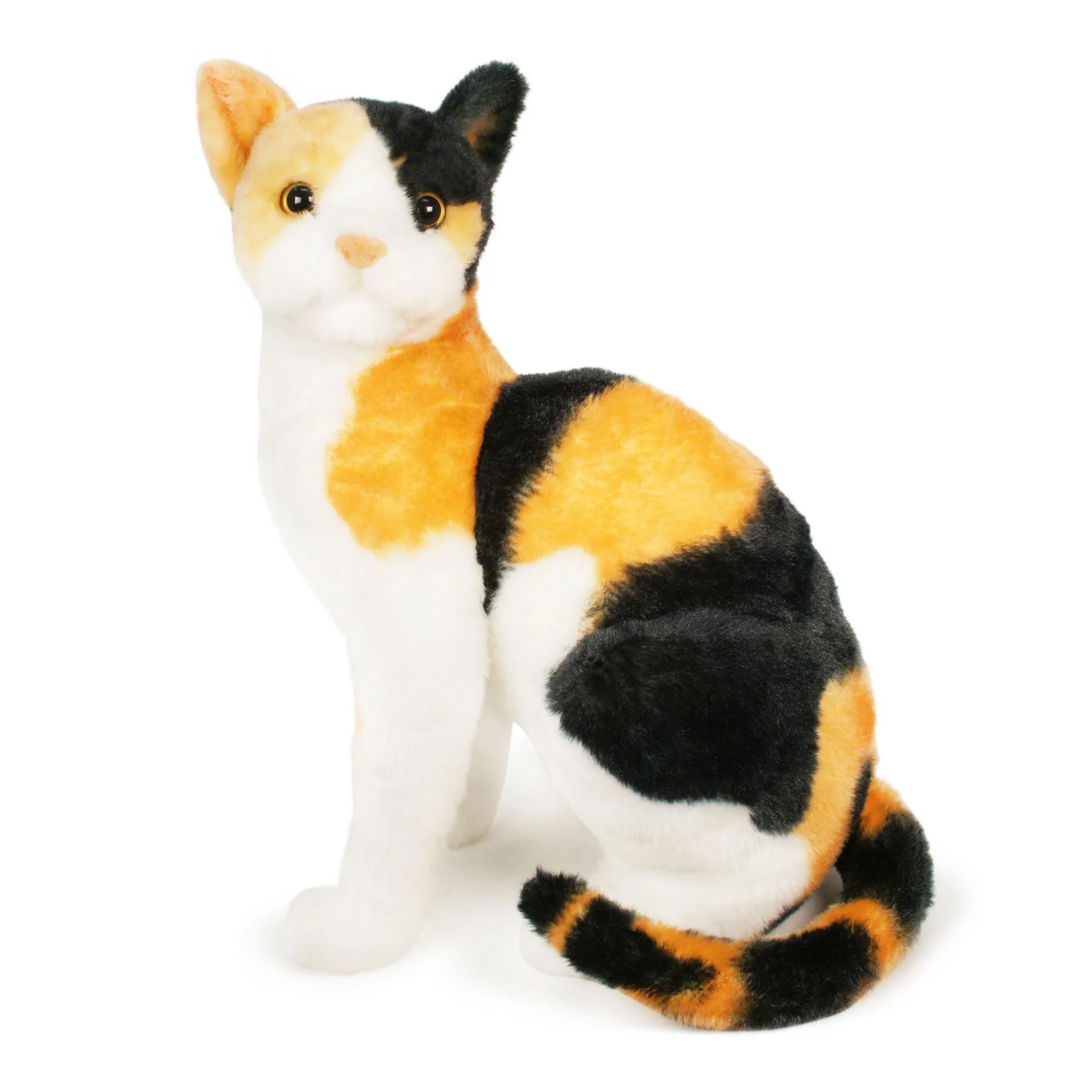 A plush calico cat what is white, orange, and black in a sitting position.