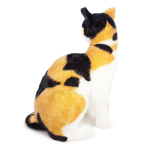 A realistic calico cat plush toy shown from the back, featuring orange, black, and white fur details on a solid white background.