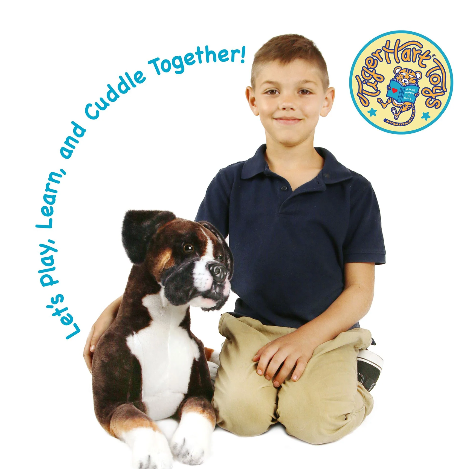 A young boy in a navy polo shirt and khaki pants sits on the floor next to a large brown and white plush dog toy, with the text 'Let's play, Learn, and Cuddle Together!' arched above them and a circular 'Tiger Hart Toys' logo in the top right corner.