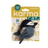 A felt cat toy shaped like a sleeping bird with a black head, white eye patch, and gray body, attached to a yellow and white Karma Cat retail card. The card includes text such as 'HAND MADE nepal', 'LANOLIN rich', and 'karma CAT'.