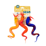 Three soft snake-shaped cat toys with printed faces, shown with their retail backing card. The packaging reads 'karma CAT' and 'HAND MADE in Nepal'