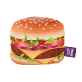 A plush hamburger toy featuring a detailed print of a cheeseburger with sesame seed bun, lettuce, tomato, red onion, and beef patty, with a purple 'Multipet' tag on the side.