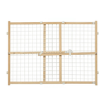 A wooden pet gate with a natural oak frame and white wire mesh panels, featuring a central latch mechanism and side adjustment knobs, shown on a plain white background.