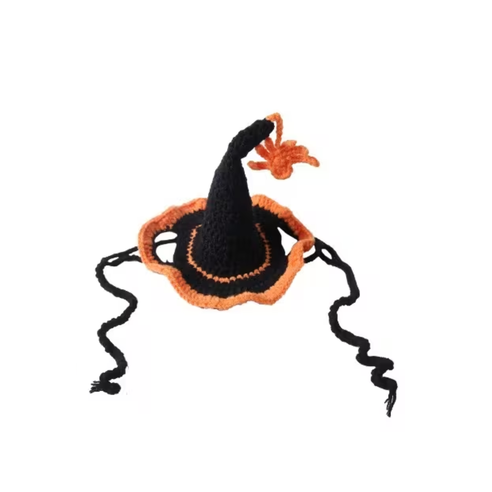 A small crocheted witch hat in black and orange with long black dangling ties and an orange spider accent on top, shown on a plain white background.