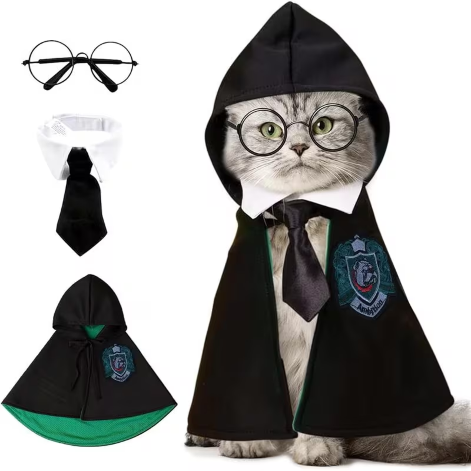 A cat wearing a black wizard-style costume cape with a white collar, black tie, and green crest patch, shown on a white background. The image also includes separate views of the costume pieces: round wire glasses, the white collar, the black tie, and the cape with green lining and crest.