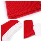 Close-up of red knitted fabric with white trim on a white background
