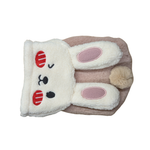 A plush bunny-shaped pet coat in cream and light pink, featuring embroidered red and black facial details, pink inner ears, and a small beige pom-pom tail on a white background.