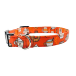 An orange dog collar with a repeating pattern of coffee cups, mugs, and a donut, featuring a black buckle and silver metal ring.