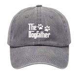 A gray washed baseball cap featuring the white text 'The Dogfather' with two paw prints, shown against a plain white background.