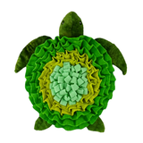 Plush green turtle shaped toy on a white background.