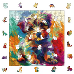 A multicolored puzzle of a Yorkshire Terrier puppy displayed on a white background. There are pop-up images highlighting the unique shapes of the puzzle pieces.