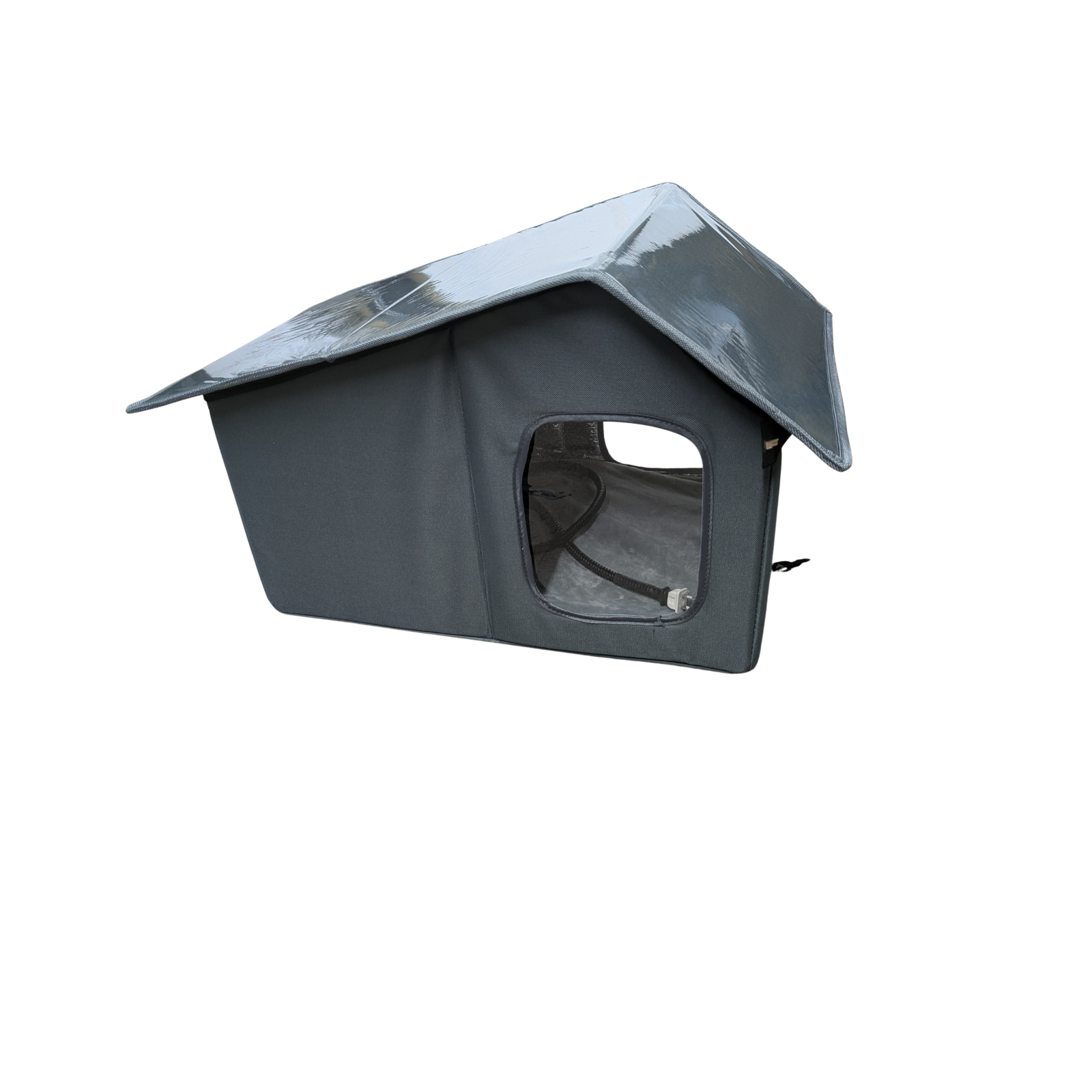 A grey fabric dog or cat house with a cord on the inside pictured at an angle to show a shiny plastic roof
